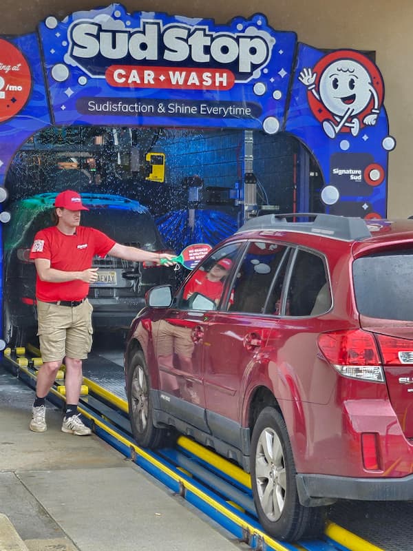 car pulls into wash tunnel at sud stop car wash in jacksonville al